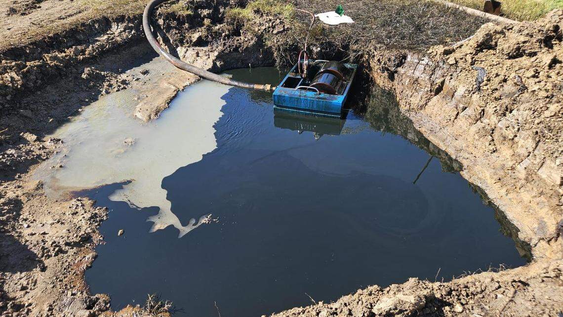 Crude oil pools at the site of a damaged pipeline north of Lake Arlington on May 8, 2025. The leak of 2,600 barrels occurred two days prior and contaminated wastewater in the Fort Worth sewer system.