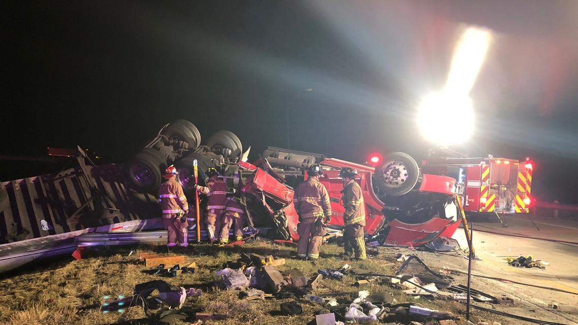 Fire crews work the scene of an 18-wheeler crash early Tuesday morning in Grapevine.