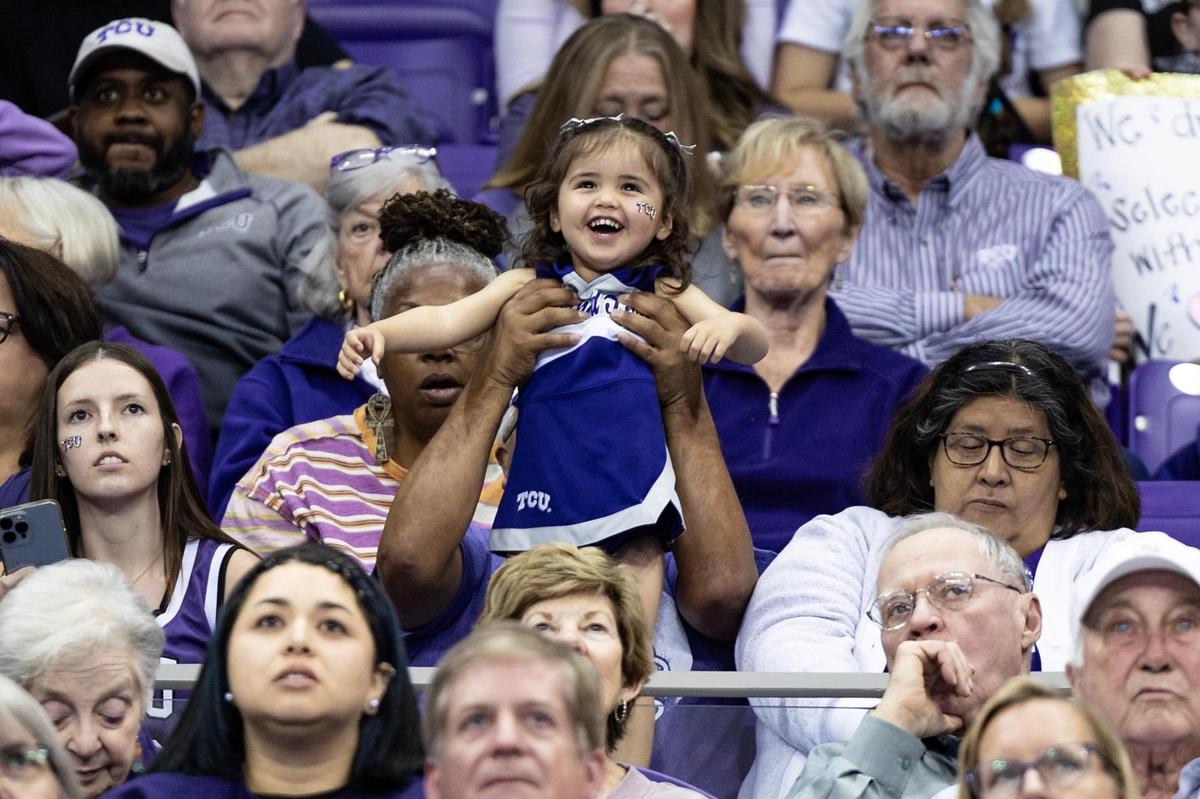 A young fan cheers on the TCU women’s basketball team as they file into the NCAA March Madness Selection Watch Party at the Schollmaier Arena in Fort Worth on Sunday, March 16, 2025. The Horned Frogs were awarded the 2nd seed and will face the 15 seeded Fairleigh Dickinson Knights.