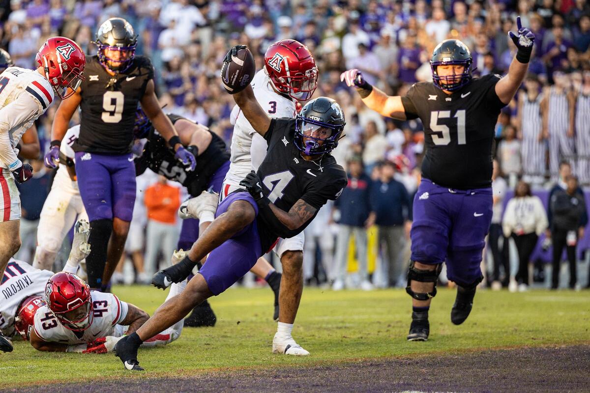TCU running back Cam Cook (4) celebrates as he scores a rushing touchdown in the second half of a NCAA football game at Amon G. Carter Stadium in Fort Worth on Saturday, Nov. 23, 2024.
