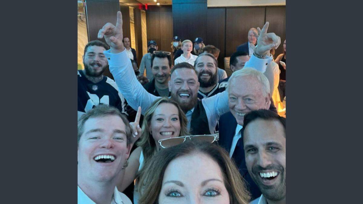Dallas Cowboys executive vice president Charlotte Jones Anderson, front, posted a celebratory image on social media with music artist Post Malone (upper left corner), MMA fighter Conor McGregor (center, arms raised), and Cowboys owner Jerry Jones (to McGregor’s left), along with other members of the Jones family Sunday after a 20-17 win against the Chargers at SoFi Stadium.
