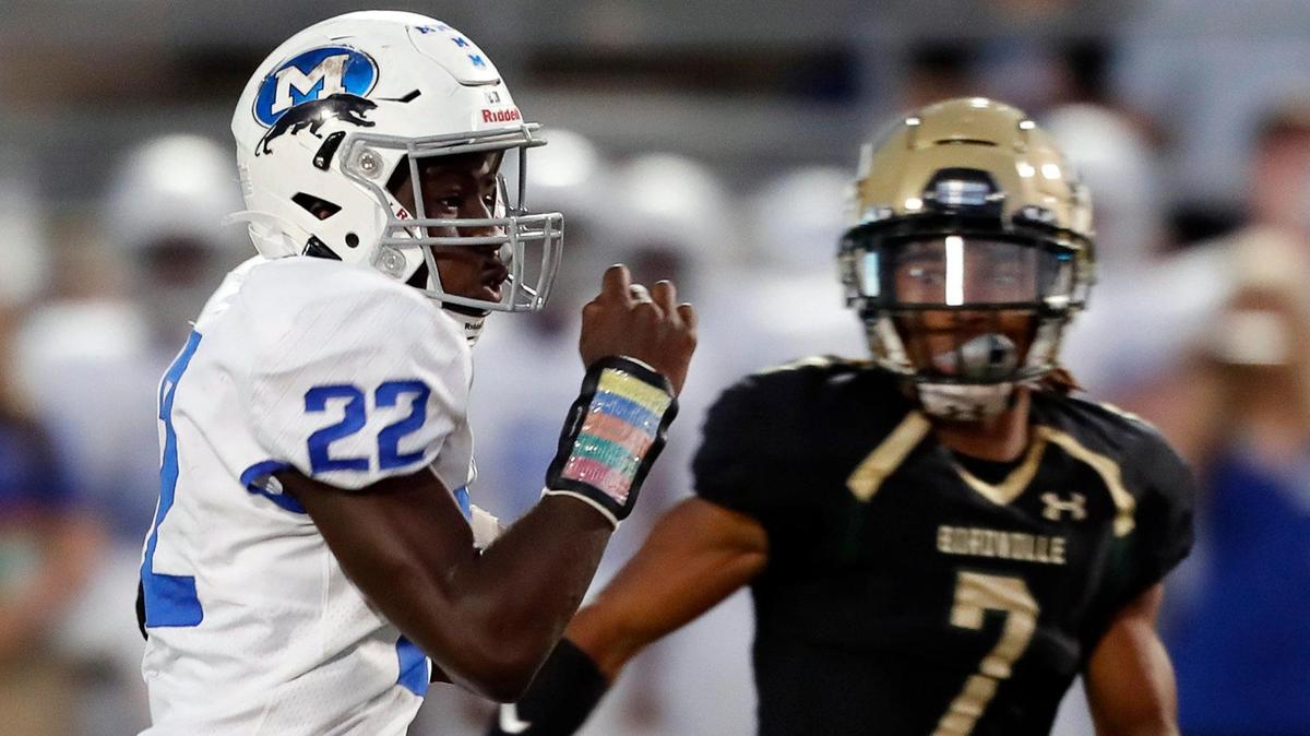 Birdville defensive back Cameron Jones (7) zeros in on Midlothian running back LJ Adeniran (22) in a high school football game at Birdville Fine Arts/Athletic Complex in North Richland Hills, Texas, Friday, Sept. 24, 2021. Midlothian led 13-7 after one half of play in a district 4-5A Division I game. (Special to the Star-Telegram Bob Booth)