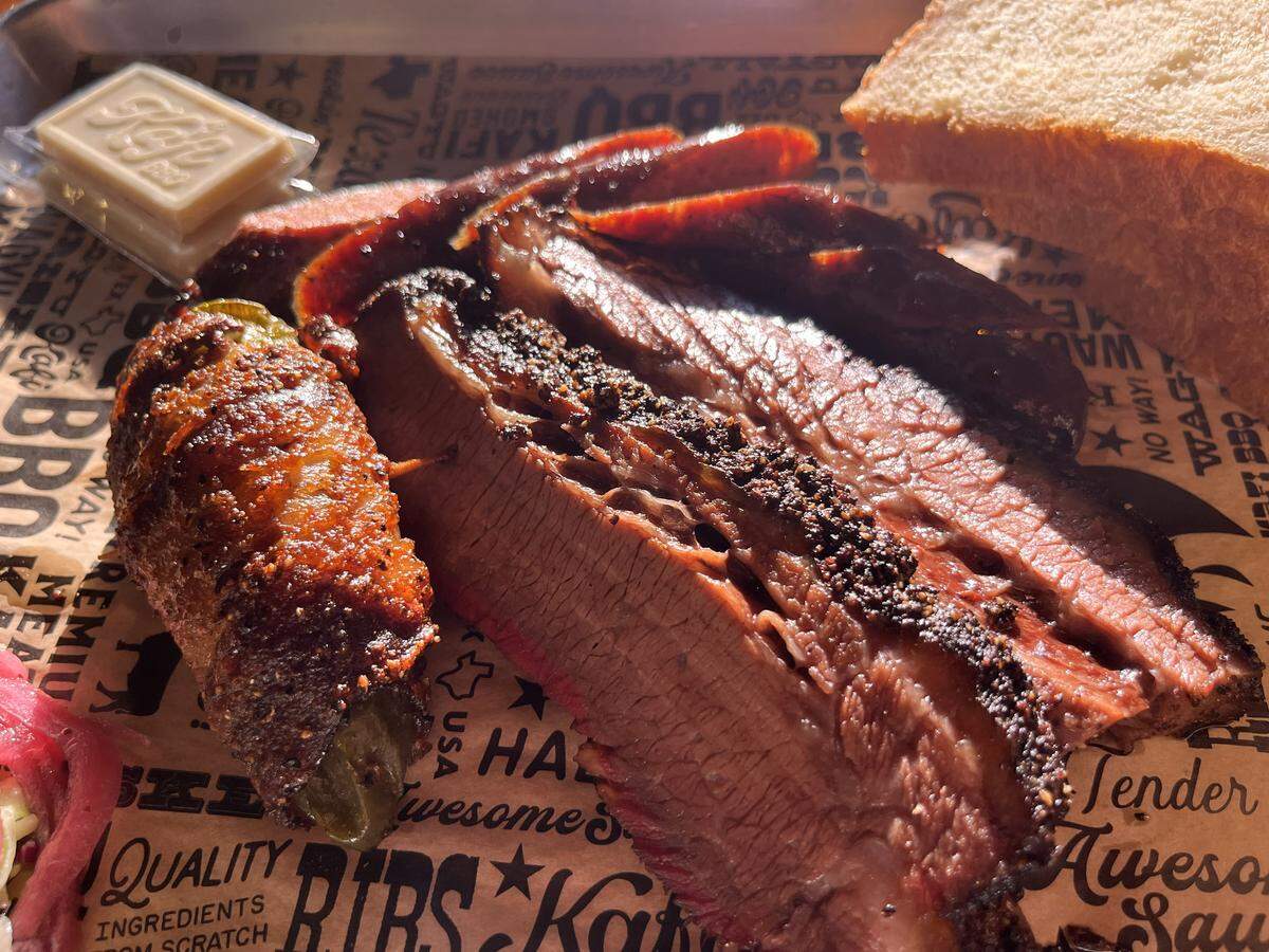 Texas Twinkie, wagyu brisket and Iraqi sausage from Kafi BBQ in Irving on Dec. 14, 2025.