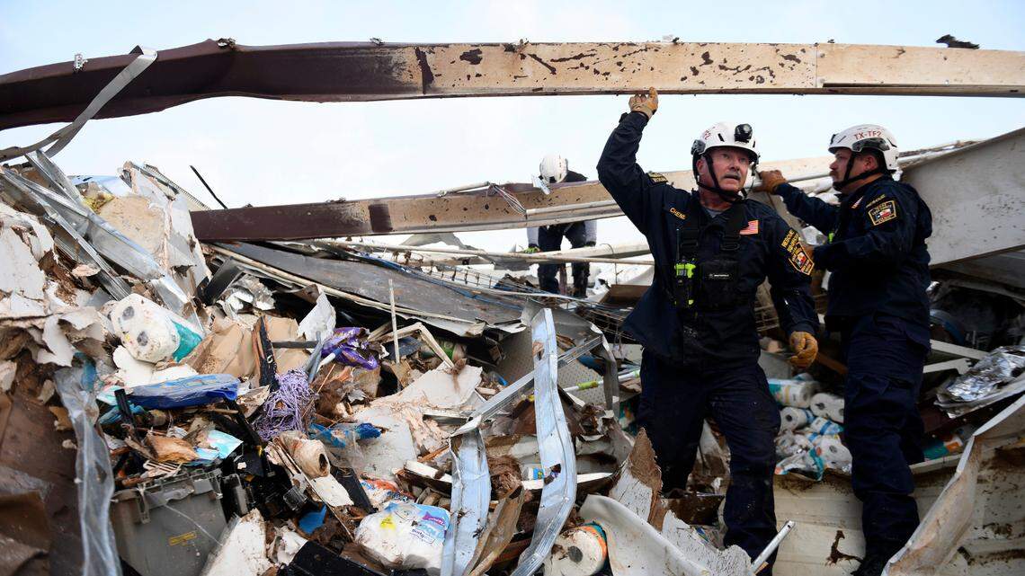 Search and rescue teams look for survivors in a former Dollar General after a tornado June 22 in Matador, Texas. A tornado warning was issued six minutes before the tornado hit. (Annie Rice/Lubbock Avalanche-Journal via AP)