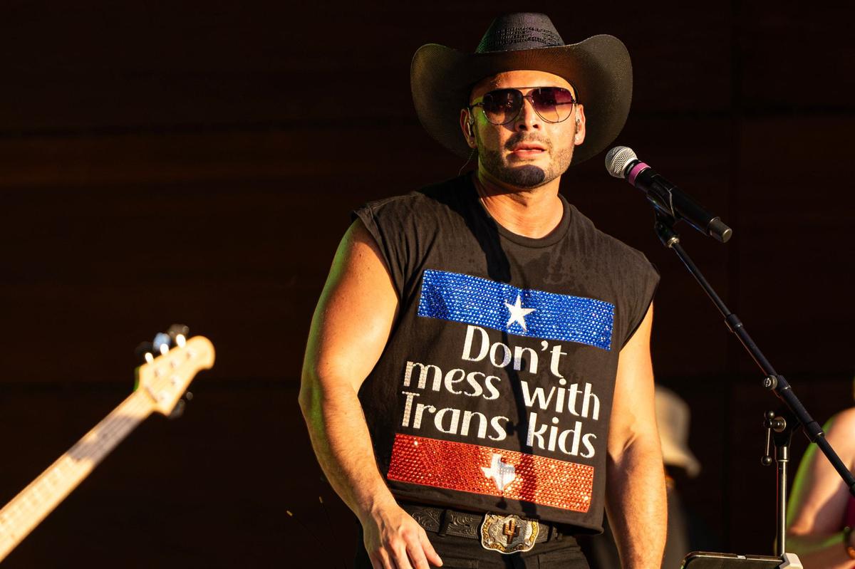Recording artist Kameron Ross performs on stage with a shirt saying “Don’t Mess with Trans Kids” at the Arlington Pride event at Levitt Pavilion in Arlington on Saturday, June 8, 2024.