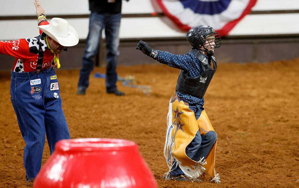 Corbin Bunn celebrates his winning run in the junior bull riding event of the Cowboys Color Rodeo on Monday, Jan. 20, 2025, at the Fort Worth Stock Show & Rodeo.