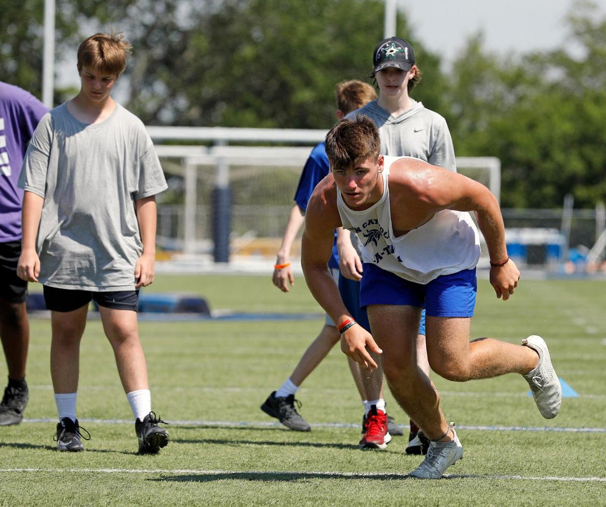 Vikings defensive end Kaleb James starts a pop up drill during morning workouts at Nolan Catholic High School in Fort Worth, Monday, June 15, 2020. Football workouts were held during distancing for Covid-19. Field temperature was 97 during the morning workout. (Special to the Star-Telegram Bob Booth)