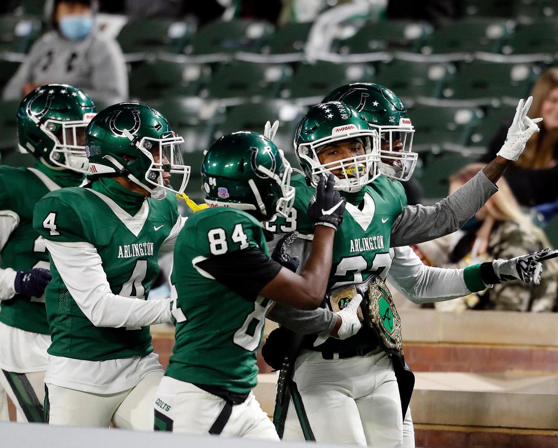 Arlington defensive back Richard Toney (23) parades around with the takeaway belt during a high school football game at Globe Life Park in Arlington Texas, Friday, Oct. 23, 2020. Toney had a pick six which also led to a 15 yard unsportsman like penalty for the Colts. The Colts defeated the Gophers 35-10. (Special to the Star-Telegram Bob Booth)