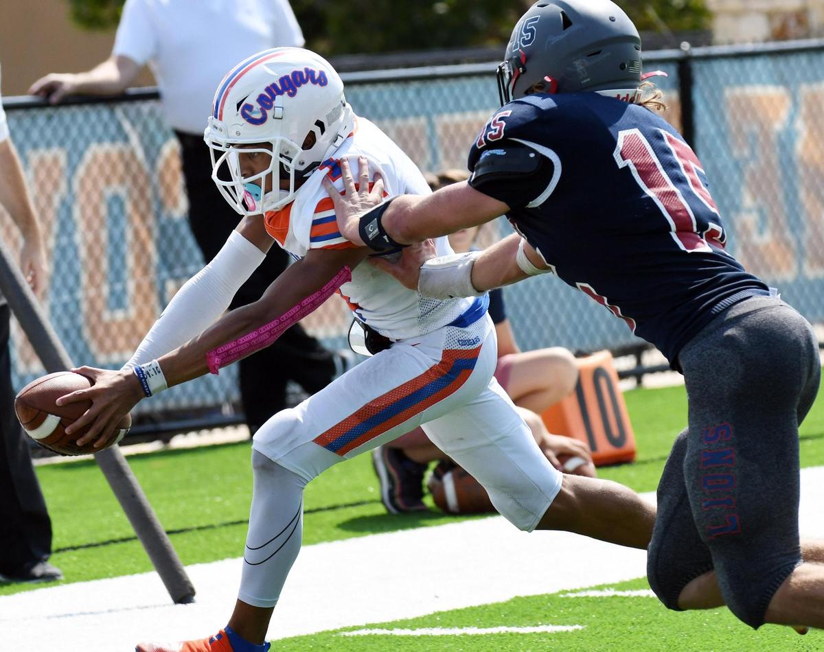 Colleyville Covenant quarterback Christian Wells, left dives for the endzone for a touchdown and a14-14 tie before Lubbock Trinity’s Davis Reeves could push him out of bounds in the fourth quarter of thier TAPPS Division 3 District 1 football game Saturday, October 3, 2020 in Colleyville, Texas. Covenant won 21-20. Special/Bob Haynes