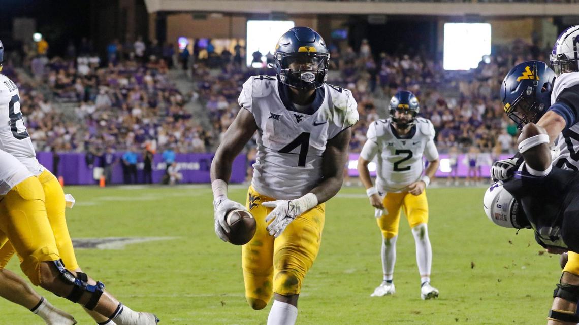 West Virginia running back Leddie Brown (4) walks in a wide open middle in the second half of a NCAA football game at Amon G. Carter Stadium in Fort Worth, Texas, Saturday Oct. 23, 2021. West Virginia defeated TCU 29-17. (Special to the Star-Telegram Bob Booth)