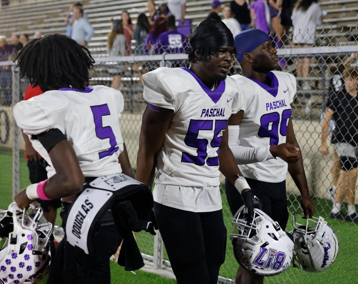 Paschal lineman Dylan Williams (55) leaves the field with team mates after he blocked a potential game winning field goal during a District 4-5A Division 1 football game at Herman Clark Stadium in Fort Worth, Texas, Thursday, Oct. 24, 2024.