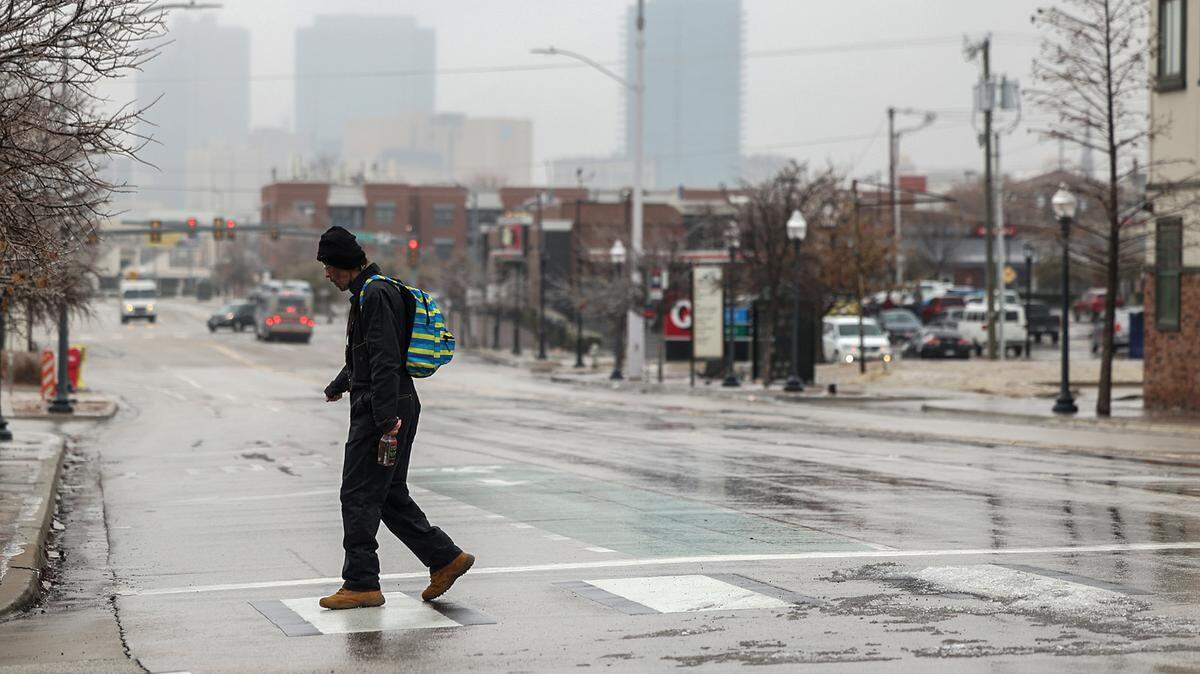 The Latest: Schools cancel, delay Friday. Roads slowly improve; thousands without power