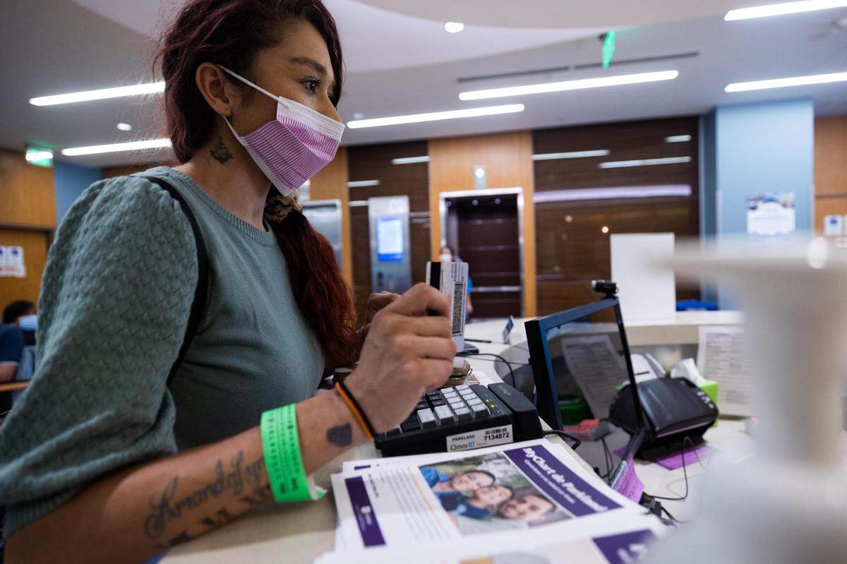 Alexandrea Ruiz checks in to her appointment at Parkland Memorial Hospital in October. Ruiz dropped off her children at Annie’s Place for free child care while she goes to her appointment.