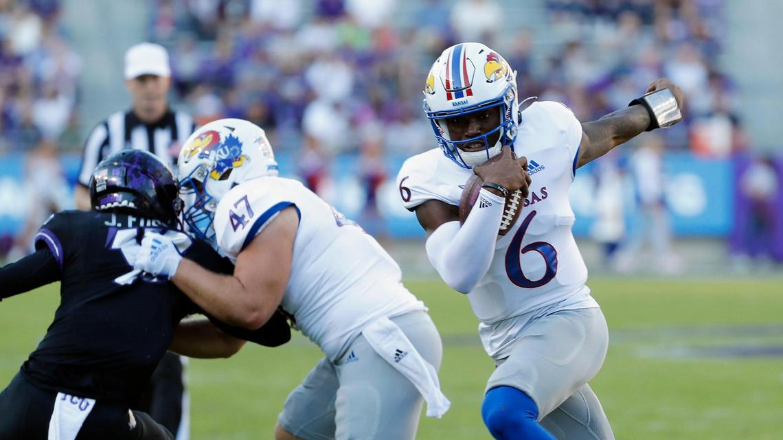 Kansas quarterback Jalon Daniels (6) follows his blocker full back Jared Casey (47) in a NCAA football game at Amon G. Carter Stadium in Fort Worth, Texas, Saturday Nov. 20, 2021. Daniels is even better this season and leads Kansas in rushing.