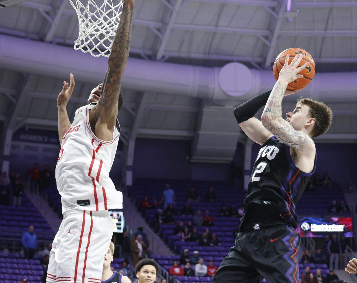 Houston forward Chris Cenac Jr. (5) attempts to block the shot of TCU guard Brock Harding (2) during the second half of a NCAA basketball game between the University of Houston and TCU at Schollmaier Arena in Fort Worth, Texas, Wednesday Jan. 26, 2026