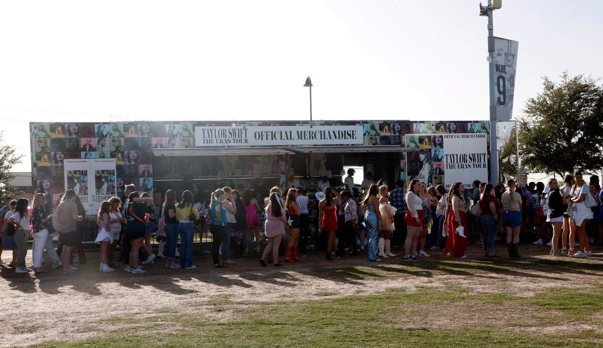 Hundreds of Taylor Swift fans line up for hours to buy merchandise before her first sold-out concert of three nights at AT&T Stadium in Arlington on Friday, March 31, 2023.