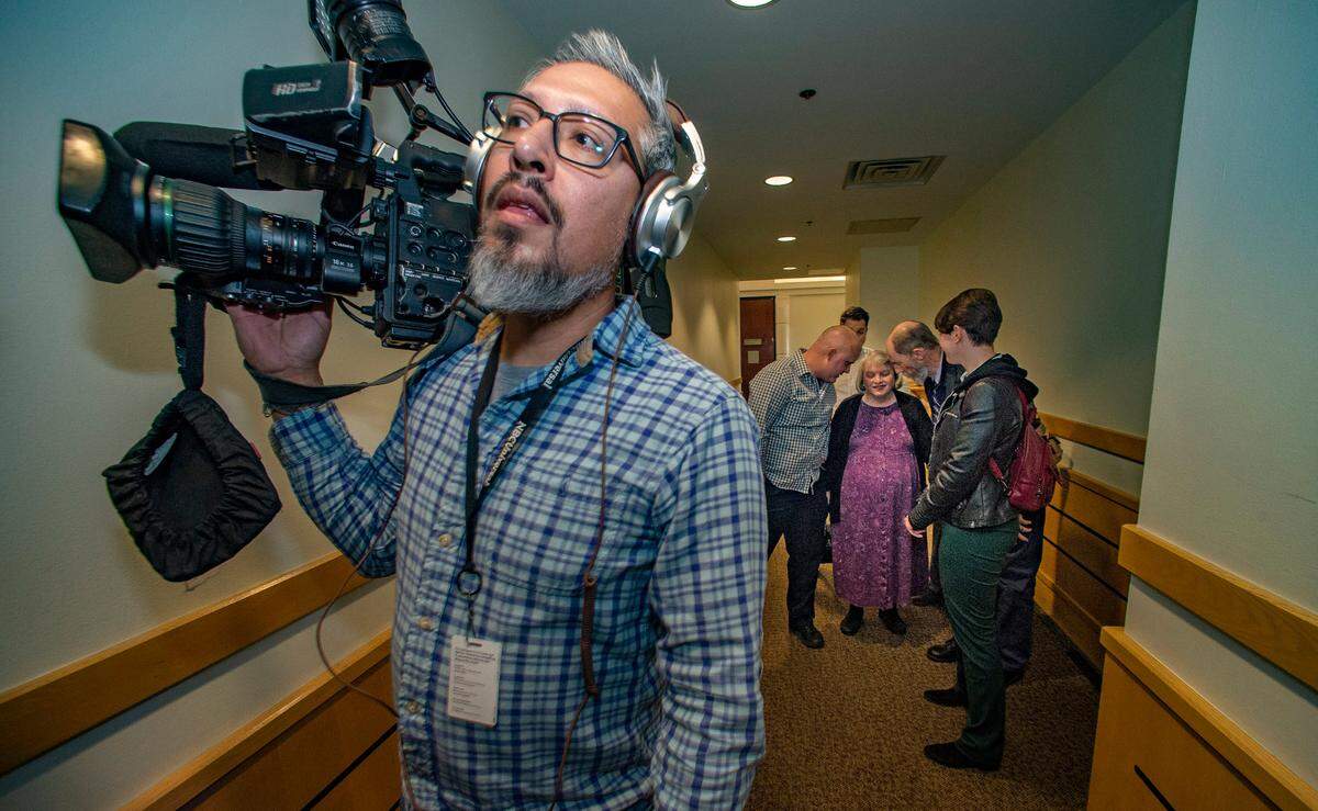 Aaron Dean’s family waits to go back inside the courtroom in the Tim Curry Criminal Justice Center for the verdict in Dean’s murder trial Thursday, Dec. 15, 2022.