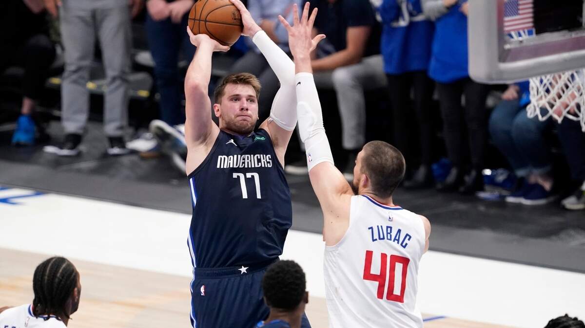 Dallas Mavericks guard Luka Doncic takes a shot as Los Angeles Clippers center Ivica Zubac defends during Game 3 at American Airlines Center Friday night.