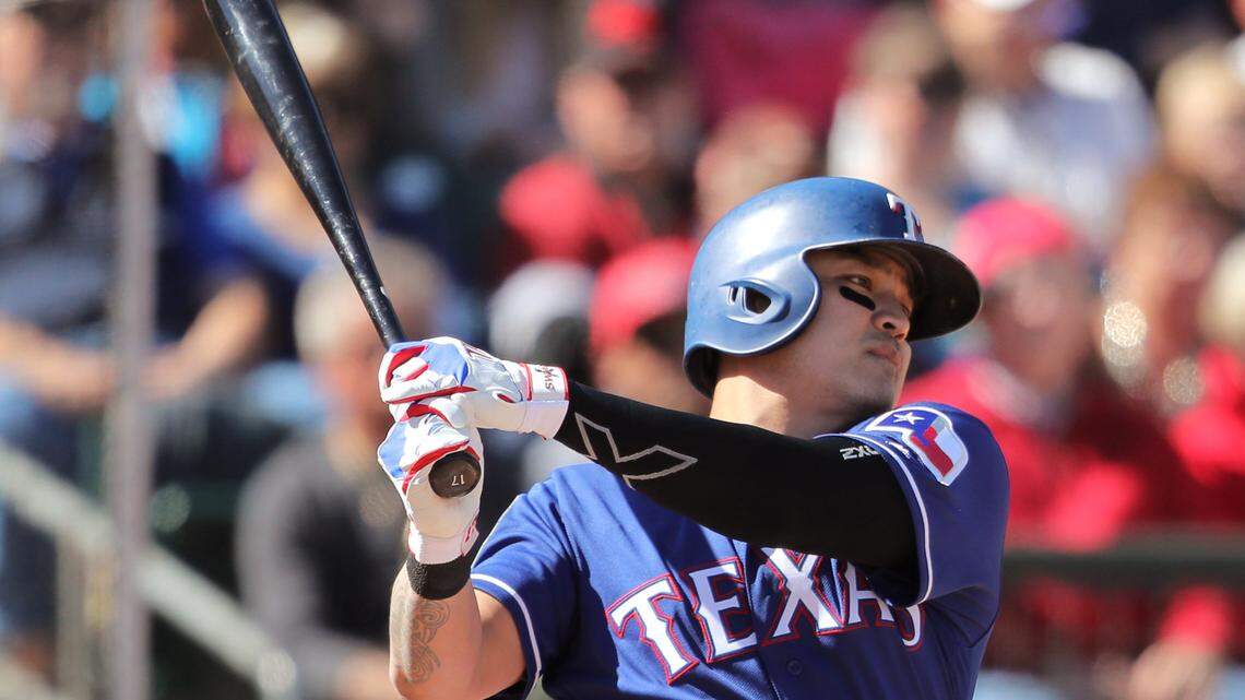 Texas Rangers outfielder Shin-Soo Choo (17) bats as the Colorado Rockies play the Texas Rangers in Surprise, Arizona, Sunday, February 25, 2018.