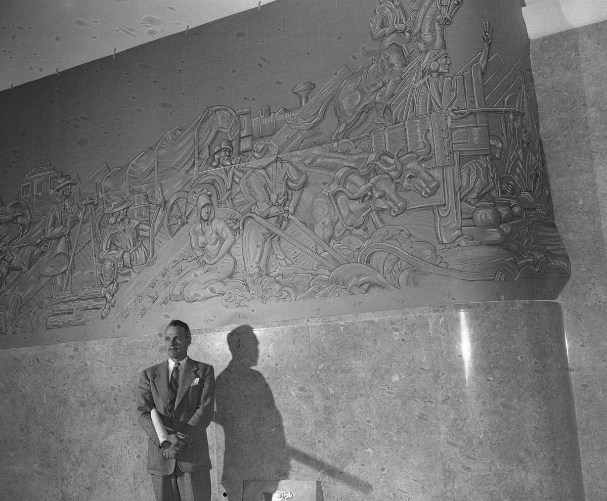 Jan. 13, 1953: James “Buck” Winn Jr. of Wimberly, Texas, beside one of the three murals he created for the Greater Fort Worth International Airport lobby.