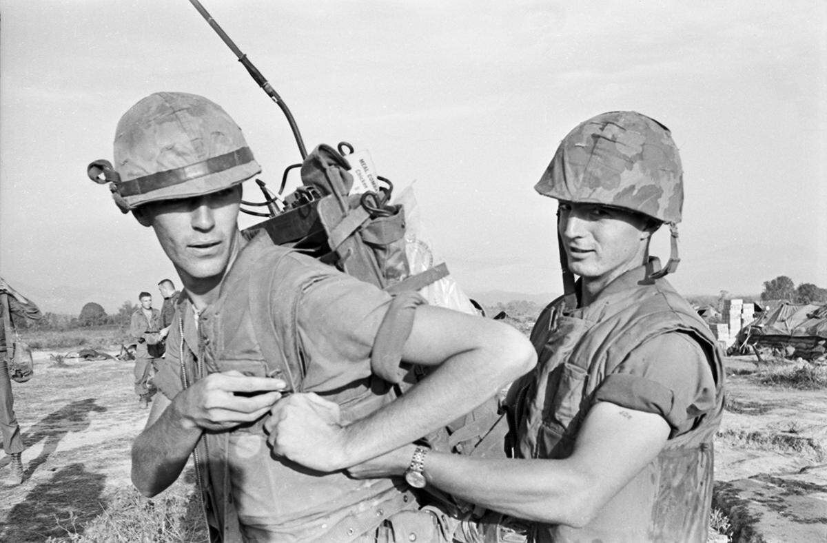 U.S. Marine Corps Cpl. Mike Britton, left, 19, of Weatherford, a radio communications operator with the 3rd Marine Regiment, serving in South Vietnam during the Vietnam War.