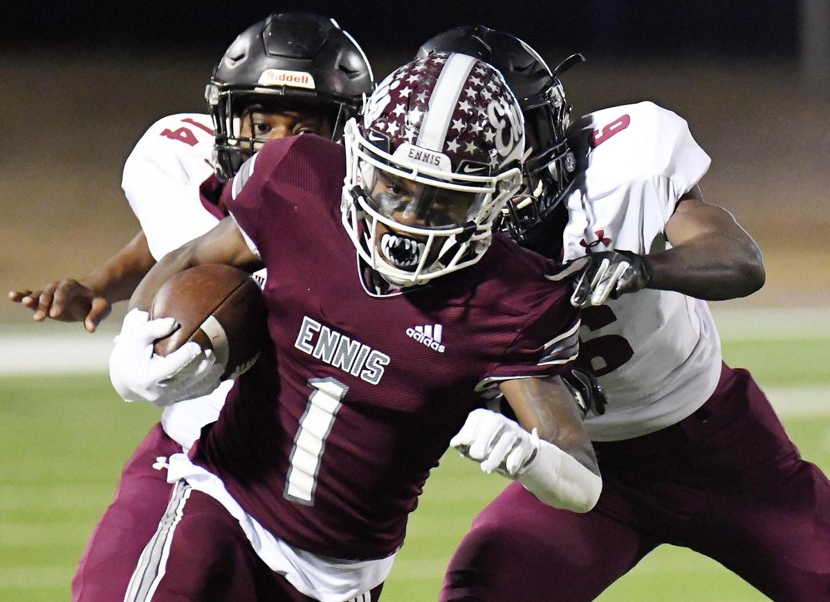 Ennis’s Karon Smith, center gets a catch past Timberview’s Kenyota Smith, left and Nivah Nyangaresi for a first down during the first quarter of their Division 2 Region 2-5A Play-off football game Friday, December 18, 2020 at the Midlothian ISD Athletic Facilities in Midlothian, Texas. Special/Bob Haynes