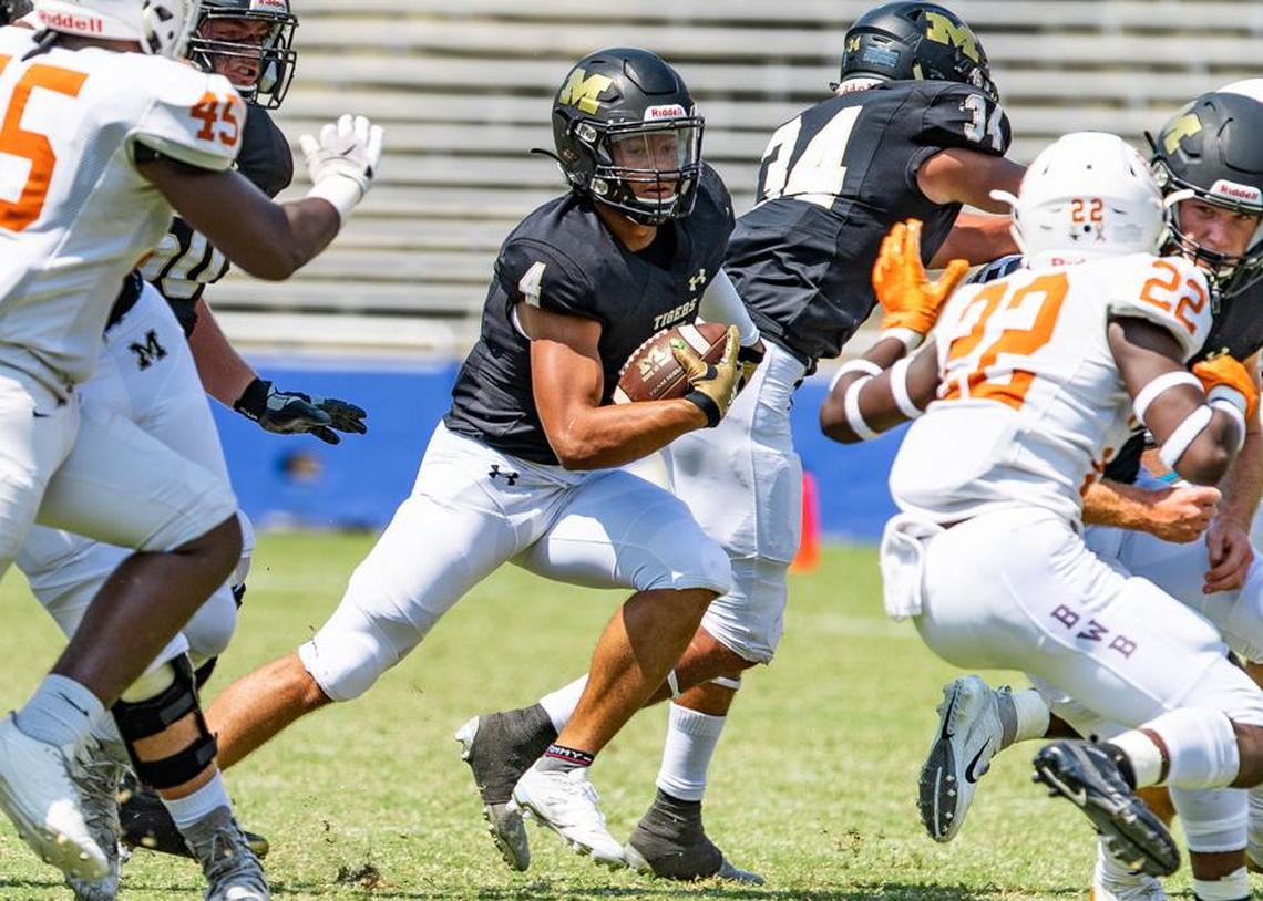Mansfield running back #4 looking for the hole.