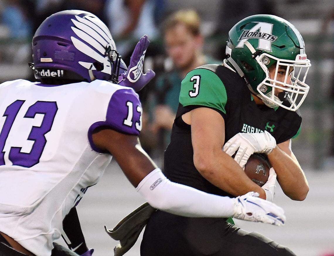 Crowley’s Darrell Talley, left chases Azle’s Jacob Lee as he breaks into the open field for a first down during the first quarter of Friday’s October 4, 2019 football game at Hornet Stadium in Azle, Texas. Special/Bob Haynes