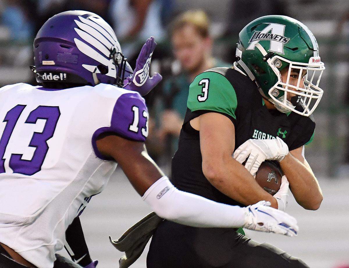 Crowley’s Darrell Talley, left chases Azle’s Jacob Lee as he breaks into the open field for a first down during the first quarter of Friday’s October 4, 2019 football game at Hornet Stadium in Azle, Texas. Special/Bob Haynes