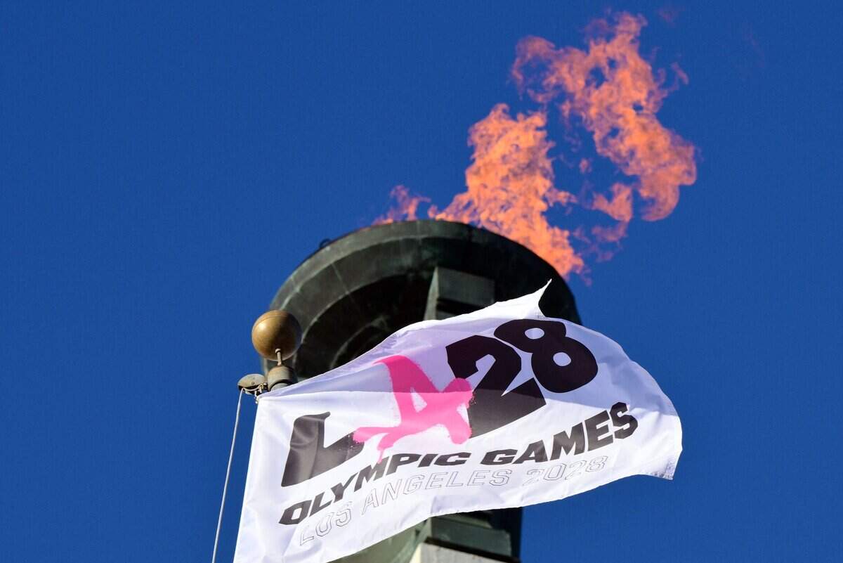 The LA28 Olympic cauldron is lit during a ceremonial lighting at the Memorial Coliseum in Los Angeles on Jan. 13, 2026, ahead of the launch of ticket registration for the 2028 Summer Olympic Games.