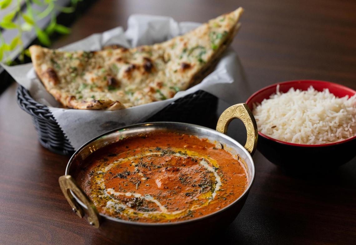 Butter chicken served with garlic naan and rice at Palate Garden on Thursday, April 3, 2025, in Saginaw.