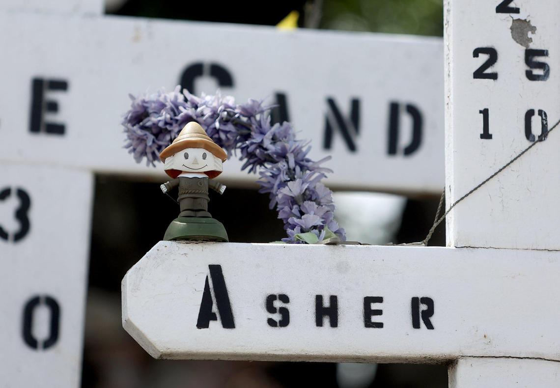 Crosses remembering Mechelle Gandy and her son, Asher, stand in the Garden of Angels memorial in Arlington on Thursday, August 25, 2022.