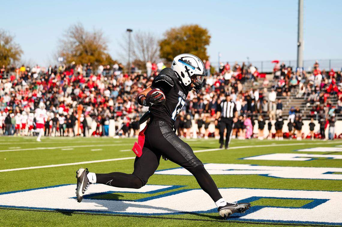 North Crowley wide receiver Lorenso Cruz (13) strides into the end zone for a touchdown in a Class 6A Division I regional playoff against Coppell on Saturday at Midlothian ISD Stadium in Midlothian.