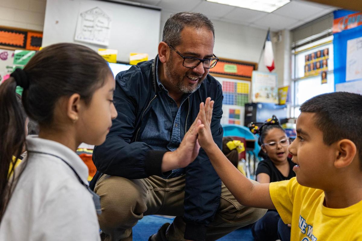 Bilingual teacher Miguel Fijó Mezquita interacts with his students while teaching them Spanish at Annie Webb Blanton Elementary School in Dallas on Tuesday, Oct. 22.