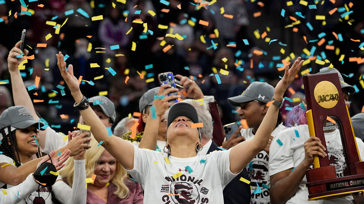 FILE - South Carolina head coach Dawn Staley celebrates after a college basketball game in the final round of the Women’s Final Four NCAA tournament against UConn, April 3, 2022, in Minneapolis. South Carolina won 64-49 to win the championship. (AP Photo/Eric Gay, File)
