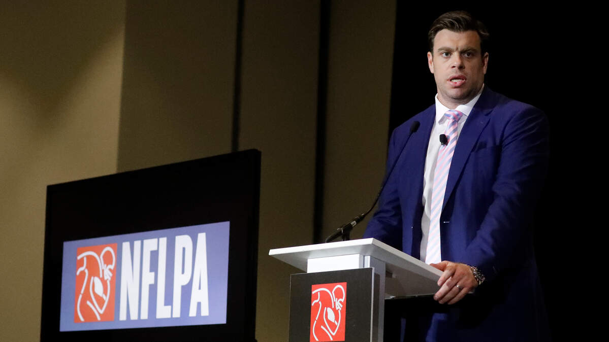 FILE - In a Thursday, Jan. 30, 2020 file photo, Eric Winston, president of the NFL Players Association, speaks at the annual state of the NFLPA press conference, in Miami Beach, Fla. NFL players have approved a new labor agreement with the league that features a 17-game regular season, higher salaries, increased roster sizes and larger pensions for current and former players. (AP Photo/Chris Carlson, File)