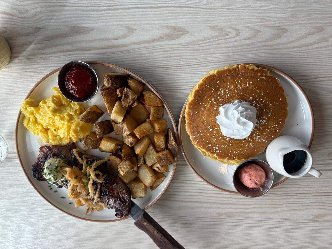 Steak and Eggs for $20, which is an 8 oz steak with house made garlic herb butter, two eggs, breakfast potatoes and pancakes and strawberry butter.