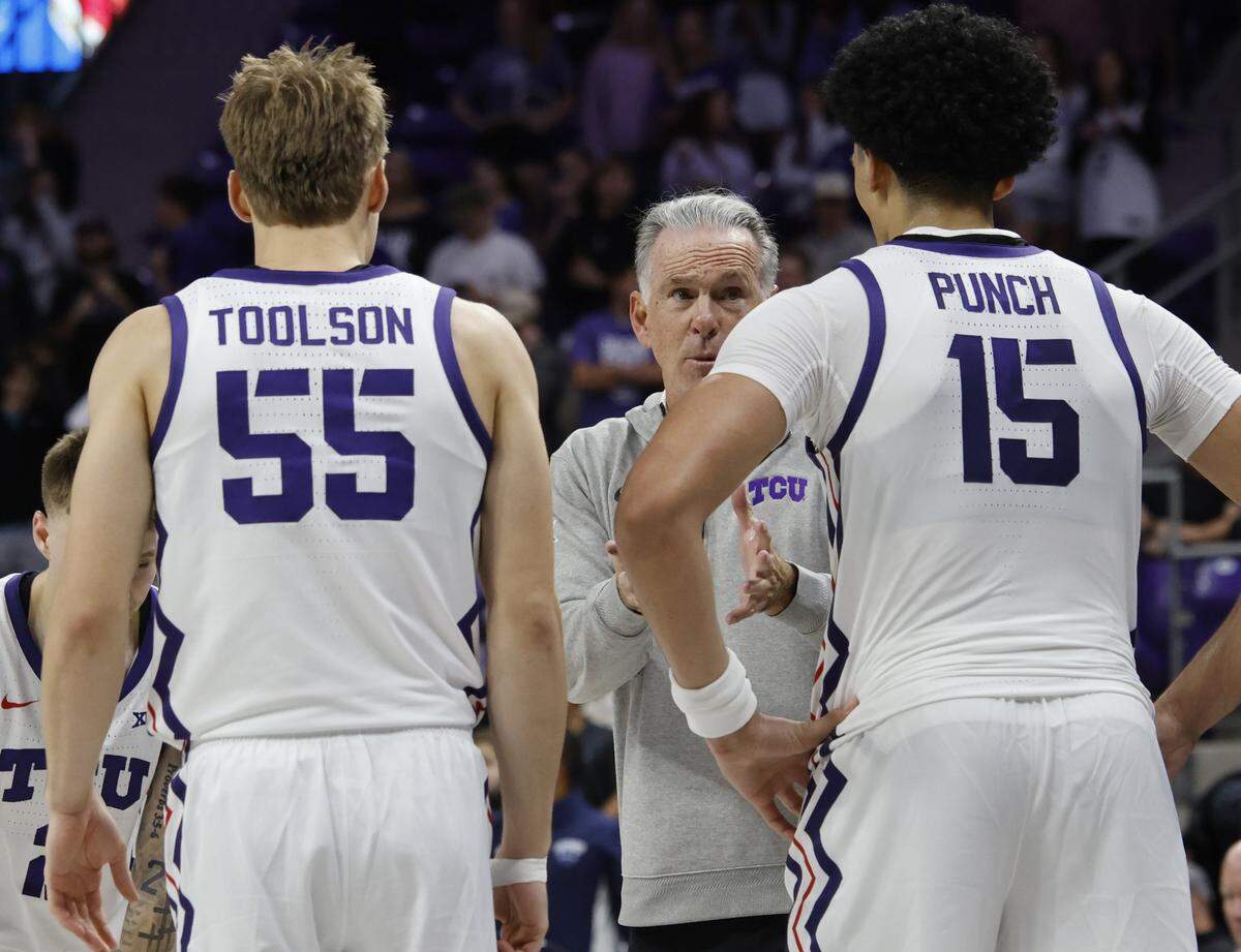 With 18.1 seconds remaining and down by two TCU head coach Jamie Dixon talks with players during a timeout during the second half of a NCAA basketball game between New Orleans University and TCU at Schollmaier Arena in Fort Worth, Texas, Monday Nov. 03, 2025. The Horned Frogs dropped their home opener 78-74 to the Privateers.