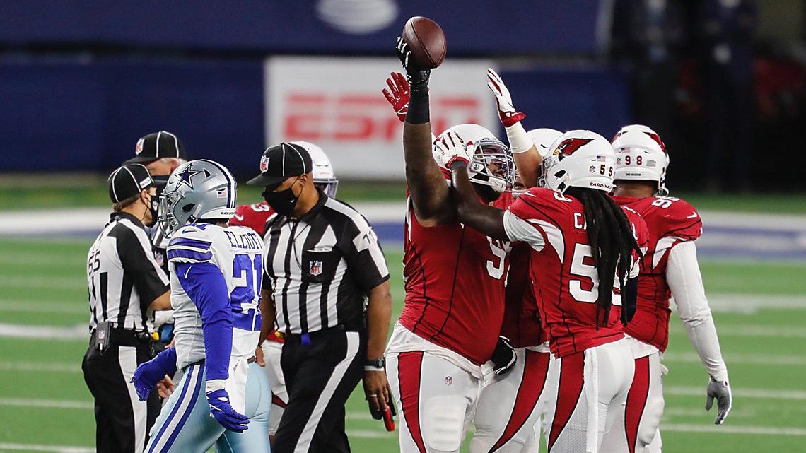 Arizona Cardinals defensive end Jordan Phillips celebrates after recovering one of Ezekiel Elliott’s two first-half fumbles in the Dallas Cowboys’ 38-10 loss Monday night at AT&T Stadium.