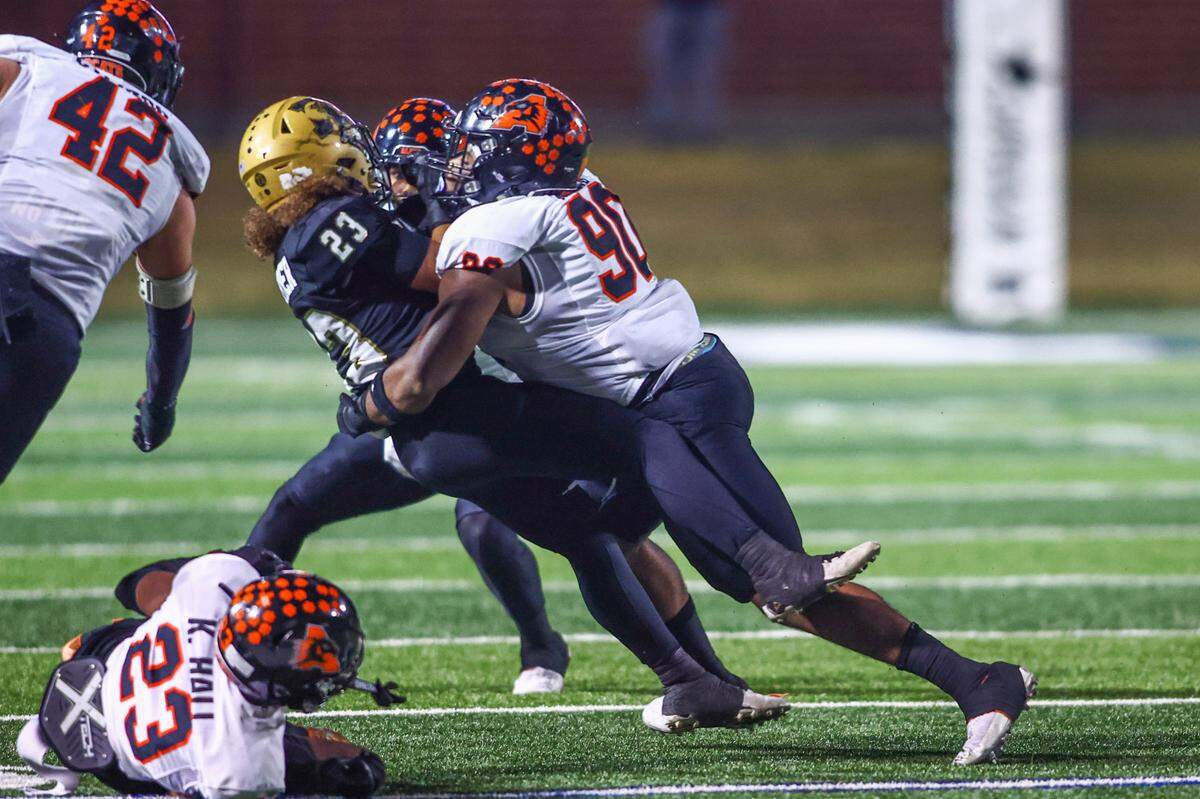 Aledo defensive tackle Tymon Meets tackles Abilene running back Ethan Joyner in the Friday, Nov. 22 playoff game at Newsom Stadium in Mansfield. Special to the Star-Telegram / Tom Marvin