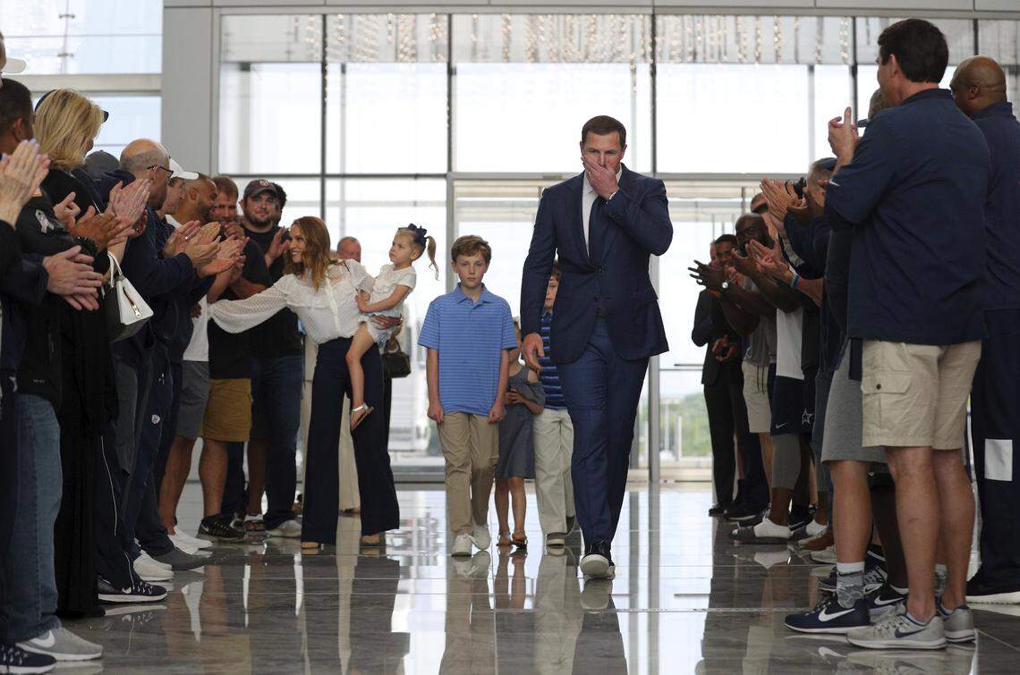 Dallas Cowboys tight end Jason Witten, center, and his family are greeted as they enter the Cowboys' headquarters before Witten announced his retirement Thursday.
