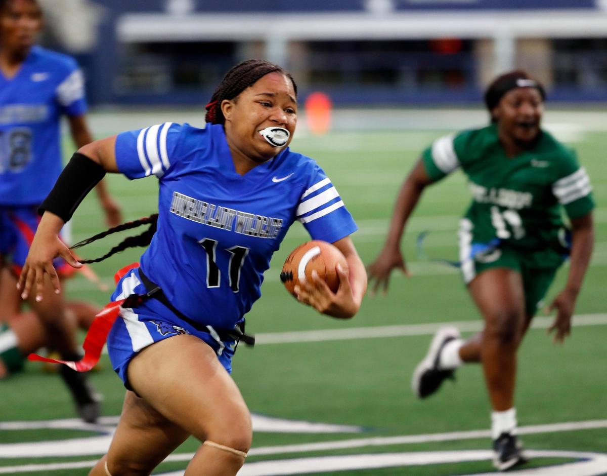 Dunbar runner Tiyanna McKinney races down the sidelines during a Fort Worth ISD flag football game at ATT Stadium in Arlington, Texas, Wednesday, May 18, 2022. Trimble Tech defeated Dunbar 34-22. (Special to the Star-Telegram Bob Booth)
