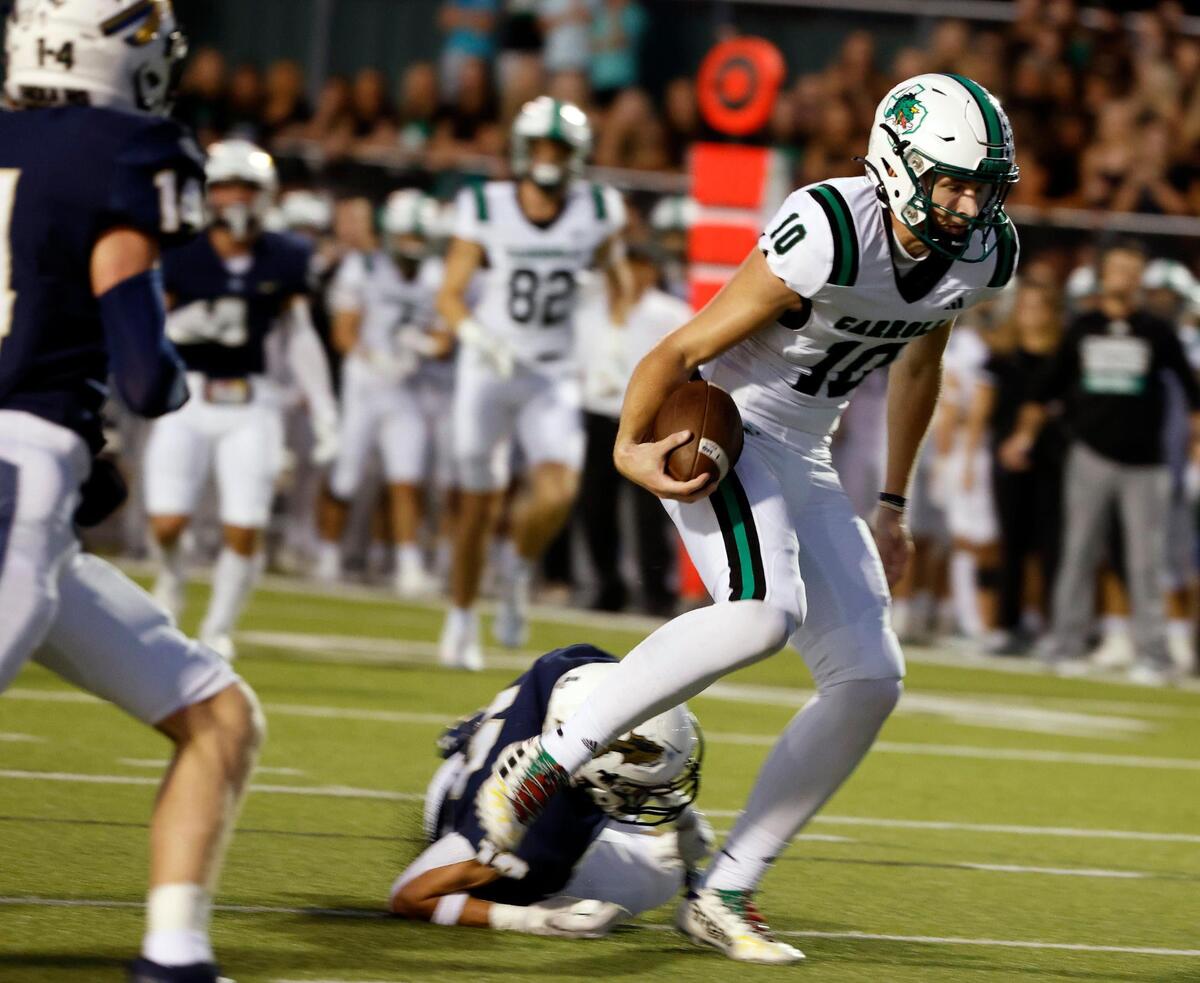Carroll quarterback Graham Knowles (10) takes the ball in for their second touchdown in the first half of a UIL football game at Keller ISD Stadium in Keller, Texas, Thursday, Oct. 05, 2023.