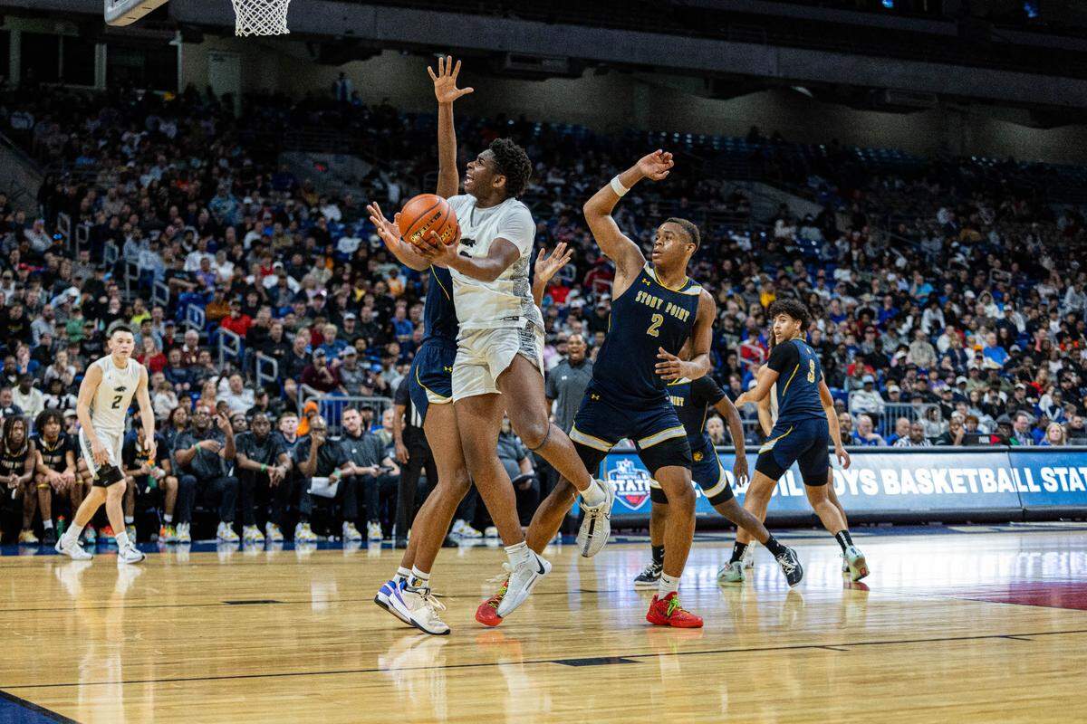Plano East forward DJ Hall (0), the Championship Game MVP, puts up a shot against Round Rock Stony Point in the Class 6A state championship game on Saturday, March 9, 2024 at the Alamodome in San Antonio, Texas. Plano East defeated Stony Point 53-41.