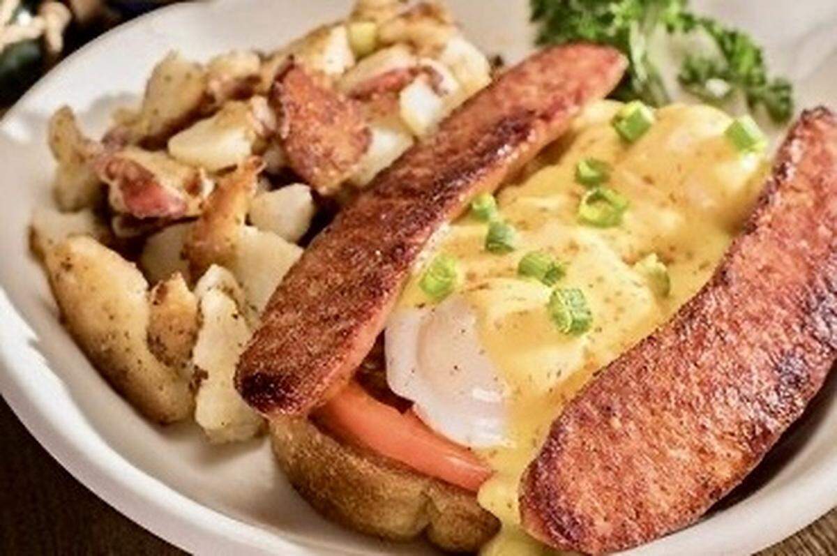 This New Orleans take on eggs Benedict is a Cajun version with andouille sausage, a featured breakfast at Huckleberry’s restaurants.