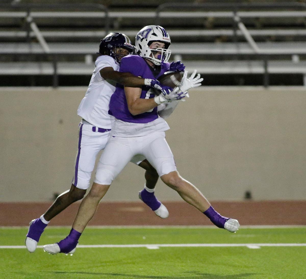Pashal’s Luke Tevis hangs on to a touchdown pass during a UIL football game at Farrington Field Stadium on Thursday, October 4, 2024.