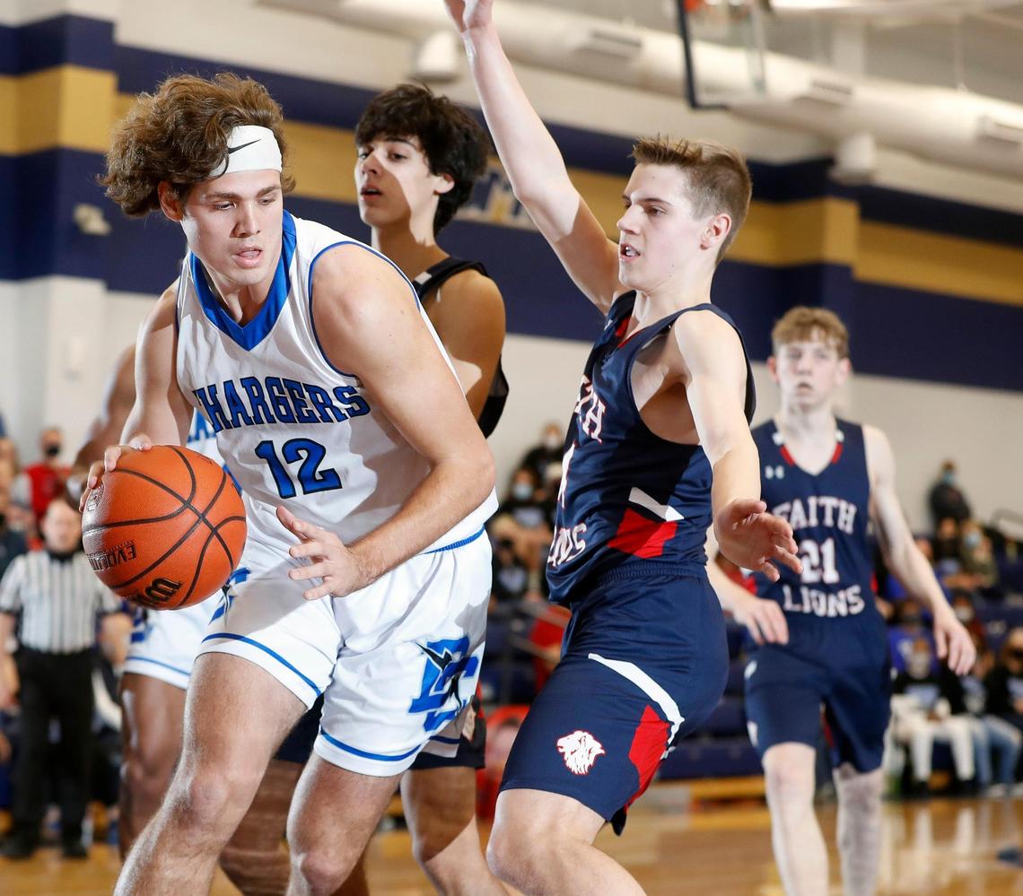 Dallas Christian forward Brett Judd (12) gets the offensive rebound during the TAPPS 5A regional basketball playoff game at Grace Prep in Arlington, Texas, Saturday, March 06, 2021. Grapevine Faith defeated Dallas Christian 52-48. (Special to the Star-Telegram Bob Booth)
