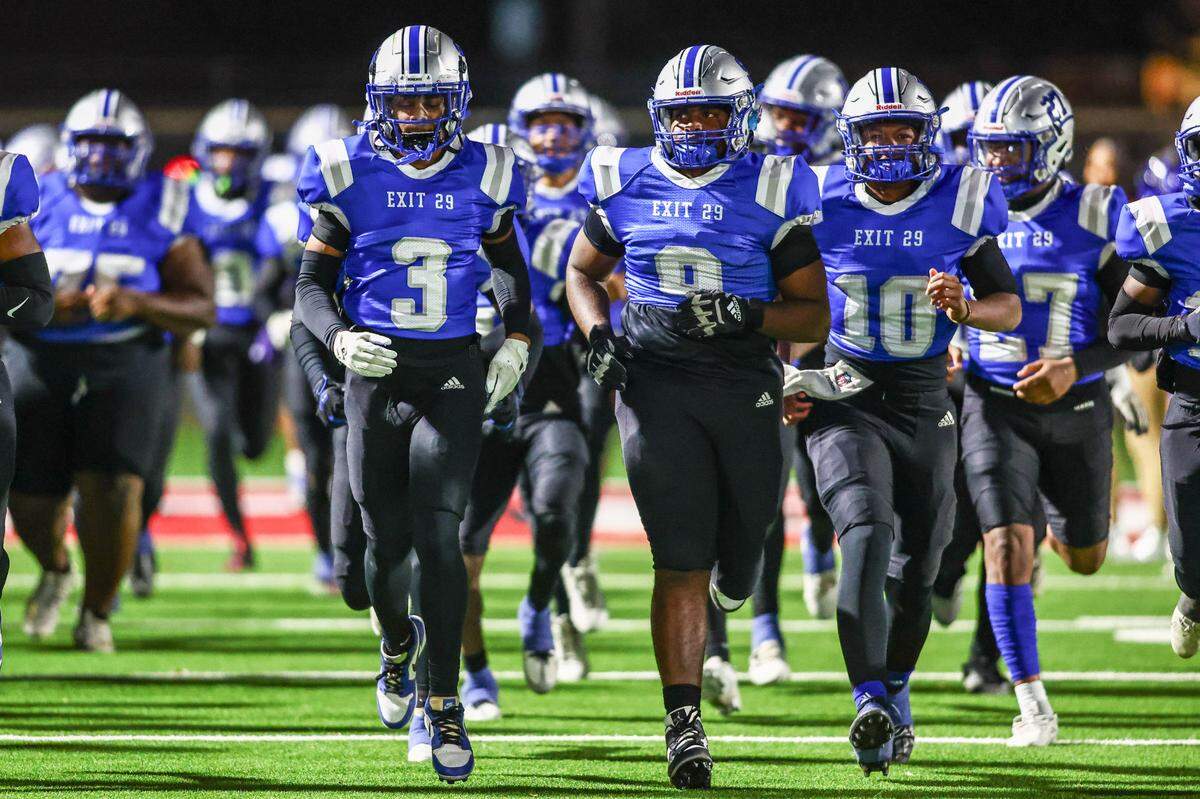 The Fort Worth Eastern Hills football team runs onto the field prior to their game against Fort Worth Southwest on Thursday, Oct. 17, 2024 at Scarborough-Handley Field in Fort Worth, Texas.
