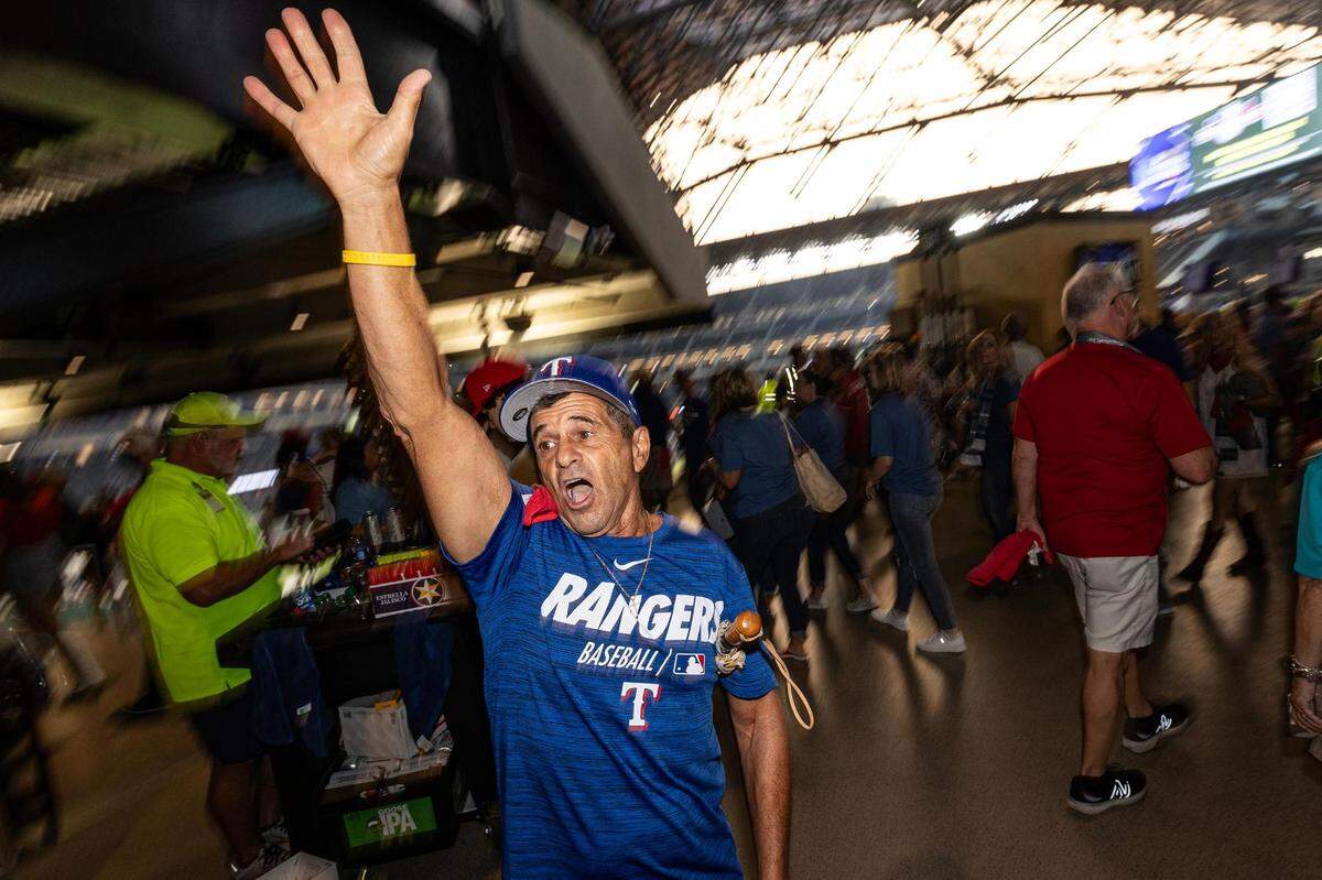 Rangers superfan Jim Giattini chants “Lets Go Rangers” among the crowd prior to game 1 of the World Series between the Texas Rangers and the Arizona Diamondbacks at Globe Life Field in Arlington on Friday, Oct. 27, 2023. Giattini said he was one of the first fans in the stadium and has not stopped chanting for over an hour.