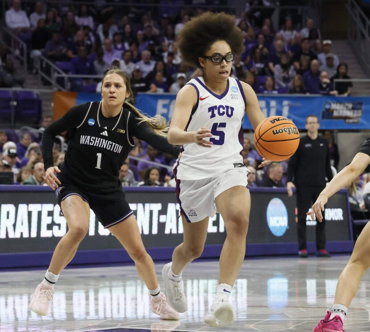TCU guard Olivia Miles (5) drives to the paint between Washington guards Hannah Stines (1) and Devin Coppinger (3) during the first half of a second round NCAA Division I Women's Basketball Championship game at Schollmeier Arena in Fort Worth, Texas, Sunday, March, 22, 2026.